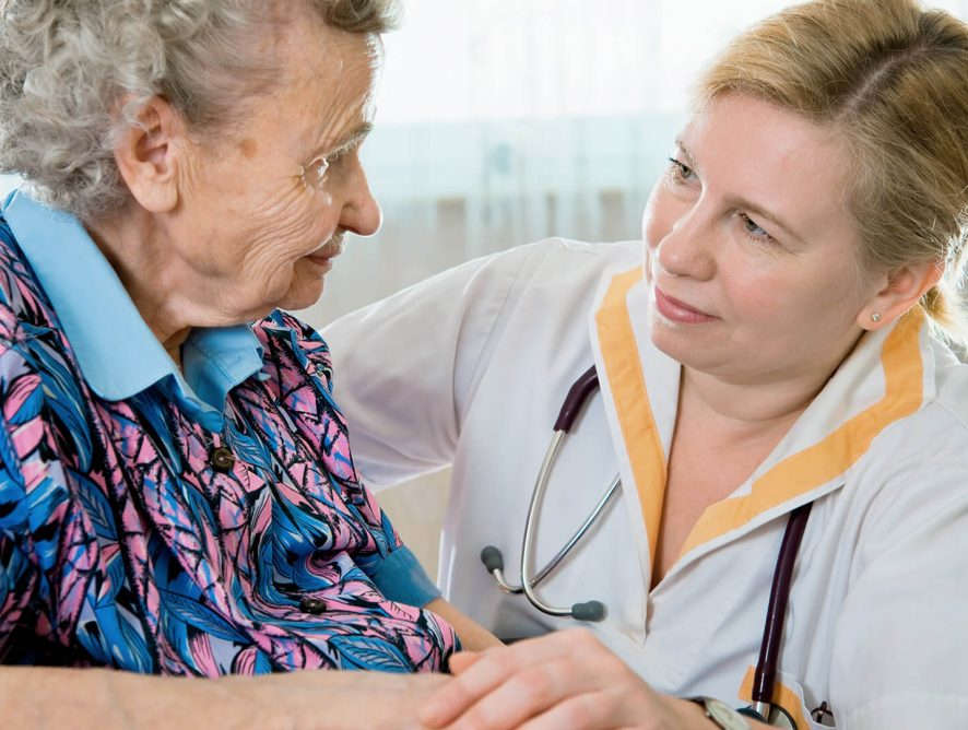 Stock photo of a nurse and a resident