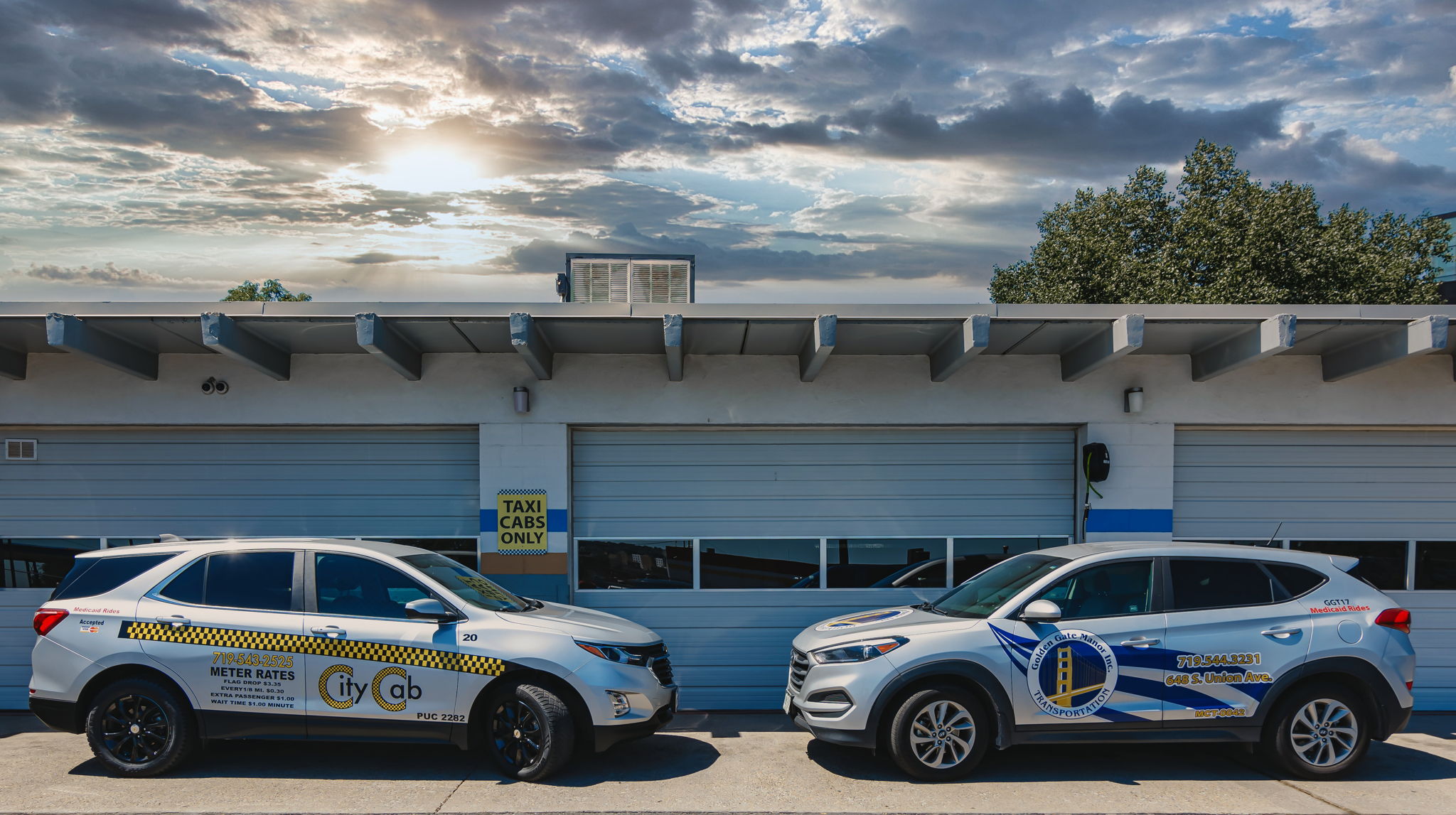 Pueblo City Cab and Golden Gate Manor Transportation vehicles in front of dispatch office.