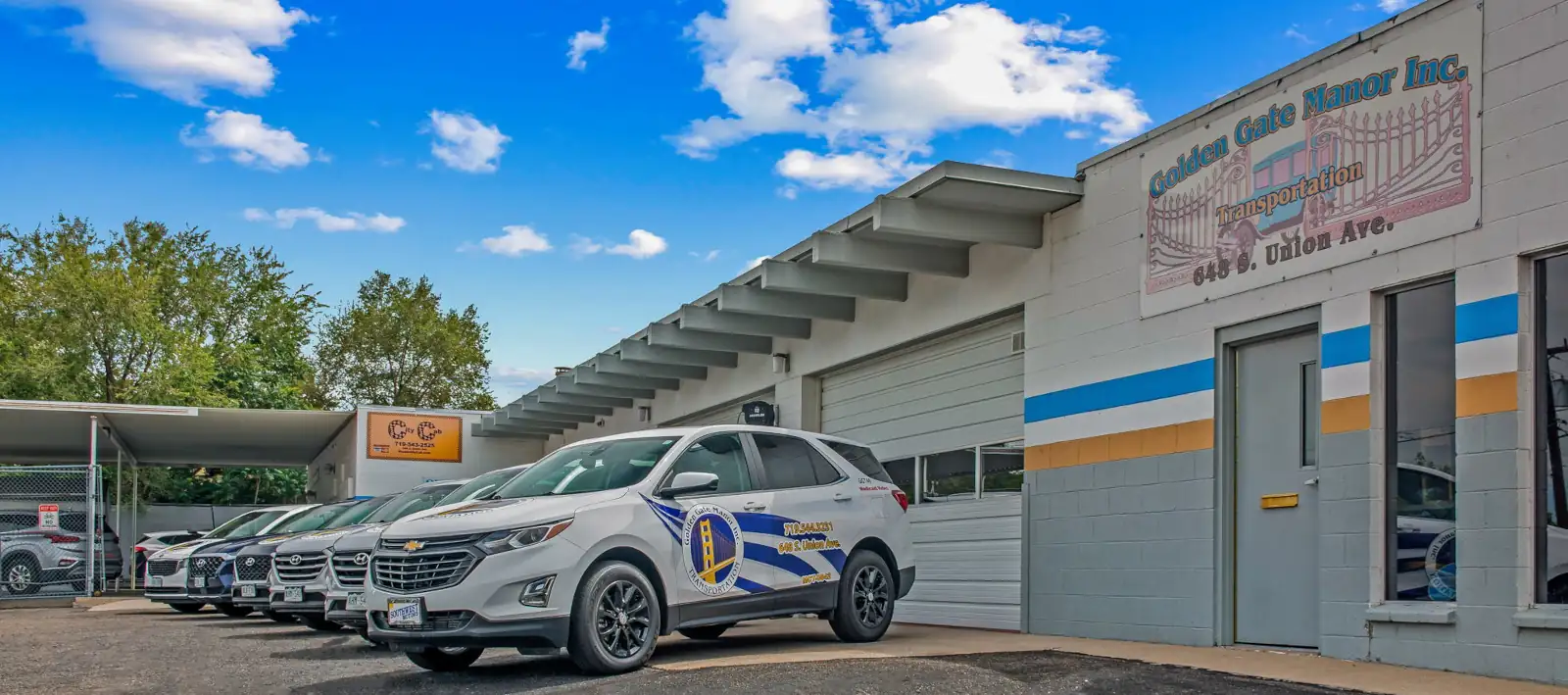 Golden Gate Manor Transportation cars lined up in front of dispatch office building.